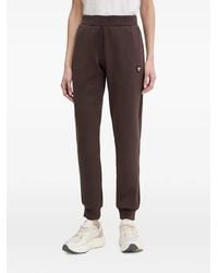 Guess - Logo-Plaque Cuffed Track Pants - Lyst
