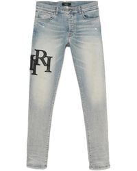 Amiri - Staggered Logo Skinny Jeans For - Lyst