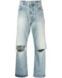Balenciaga - Distressed Low-rise Wide-leg Jeans - Lyst