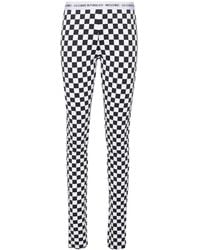 Moschino - Checkerboard-Print Flared Trousers - Lyst