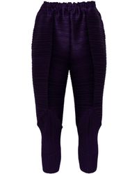 Pleats Please Issey Miyake - Tapered pleated trousers - Lyst