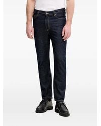 Sisley - Contrast-Stitch Logo-Patch Jeans - Lyst