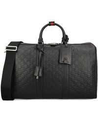 Gucci - Medium Gg Emblem Embossed Holdall - Lyst