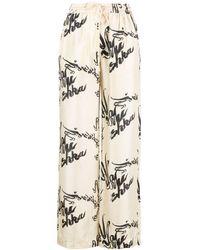 Nanushka - Jarine Calligraphy-print Silk Trousers - Lyst