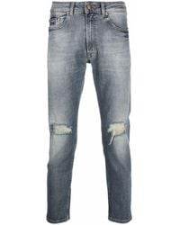 Versace - Schmale Jeans mit Distressed-Detail - Lyst
