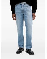 Guess - Logo-Patch Jeans - Lyst