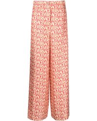 Versace - Allover Silk Trousers - Lyst