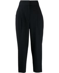 GOODIOUS - Pleated Tapered-leg Trousers - Lyst