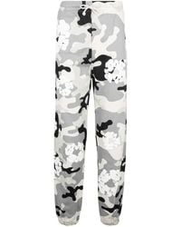 DENIM TEARS - Camouflage-Print Trousers - Lyst