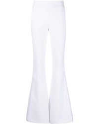 Genny - Zipped Flared Trousers - Lyst