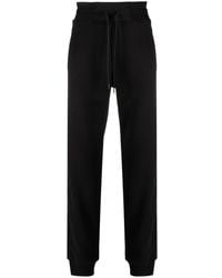 Versace - Pantalones de chándal con franja del logo - Lyst