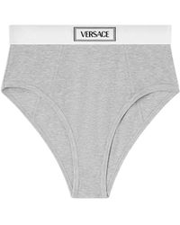Versace - Fijngeibbelde Slip Met Logoband - Lyst
