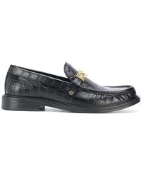 Scarpe slip on da uomo di Moschino a partire da 110 €