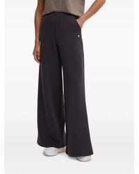 Guess - Logo-Plaque Wide-Leg Trousers - Lyst