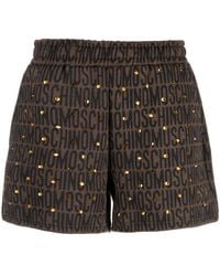 Moschino - Logo-Print Studded Shorts - Lyst