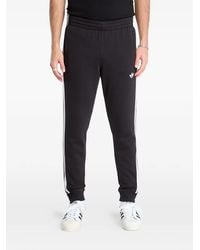 adidas - Stripe-Detail Logo Track Pants - Lyst