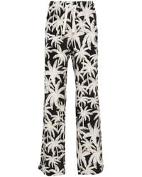 Palm Angels - Allover Logo Loose Fit Trousers - Lyst