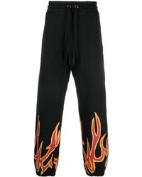 Palm Angels - Pantalones joggers con detalle de llamas - Lyst