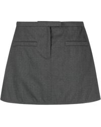 Courreges - Logo-Appliqué Trapeze Miniskirt - Lyst