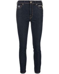 Versace - Skinny-Jeans mit Logo-Patch - Lyst