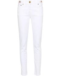 Versace - Medusa-Plaque Skinny Jeans - Lyst