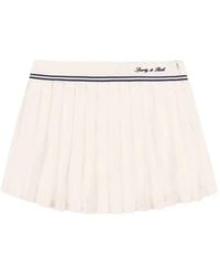 Sporty & Rich - Serif Pleated Logo-Embroidered Mini Skirt - Lyst