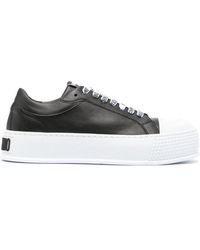 Moschino - Logo-embossed Low-top Sneakers - Lyst
