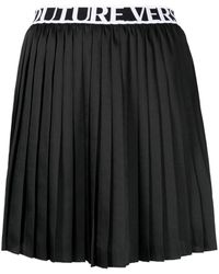 Versace - Logo-waistband Pleated Skirt - Lyst
