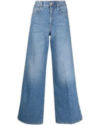 Stella McCartney - Weite Jeans mit Logo-Streifen - Lyst