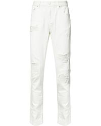 white shredded jeans