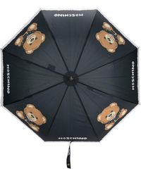 Damen Accessoires Regenschirme Moschino Regenschirm mit Logo-Print in Blau 