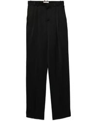 Saint Laurent - Pantalones de satén - Lyst