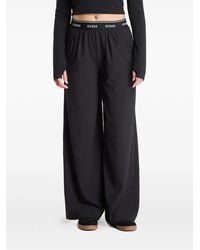 Guess - Selene Logo-Waistband Wide-Leg Trousers - Lyst