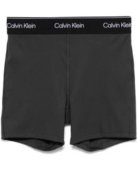 Calvin Klein - Pantalones cortos de compresión con logo en la cinturilla - Lyst