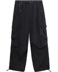 and wander - Cargohose mit mehreren Taschen - Lyst