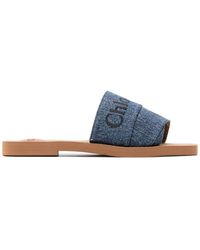 Chlo Woody Slippers Met Geborduurd Logo in het Blauw Lyst NL