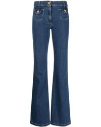 Moschino - Bear-motif Buttons Jeans - Lyst