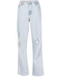 Calvin Klein - Ripped wide-legged Jeans - Lyst
