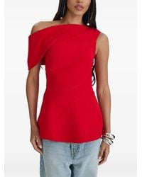 MOOS STUDIO - Top Con Una Manga Y Peplum - Lyst