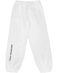 Gosha Rubchinskiy - Logo-Print Cuffed Track Pants - Lyst