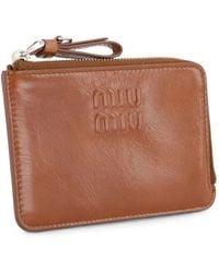 Miu Miu - Logo-Embossed Leather Clutch Bag - Lyst