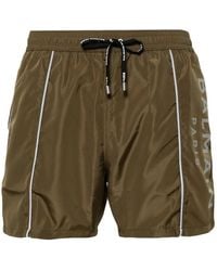 Balmain - Logo-Print Swim Shorts - Lyst