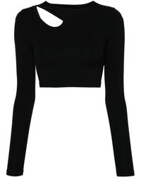 Wolford - Top Warm Up con dettaglio cut-out - Lyst