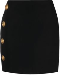 Balmain - Minifalda con botones en relieve - Lyst