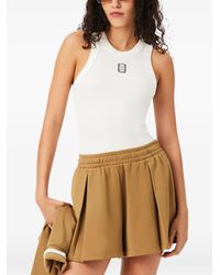 Lacoste - Sleeveless Slim-Fit Ribbed-Knit Top With Emblem Detail - Lyst