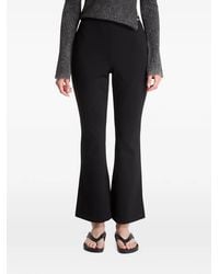 Calvin Klein - Logo-Print Flared Tailored Trousers - Lyst