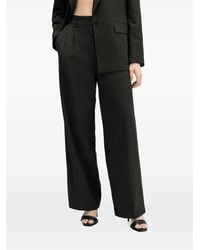 AllSaints - Averie Pinstripe Pleated Trousers - Lyst