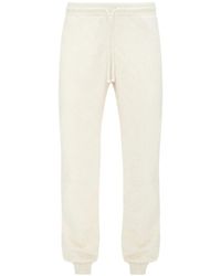 JW Anderson - Slogan-Embroidered Cotton Track Pants - Lyst