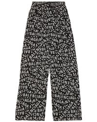 Balenciaga - Pantalones anchos con logo estampado - Lyst