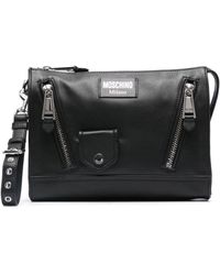 Moschino - Logo-appliqué Leather Clutch Bag - Lyst